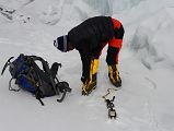 02 Climbing Sherpa Lal Singh Tamang Puts On Crampons As We Prepare To Go Through The Broken Up East Rongbuk Glacier On The Way To Lhakpa Ri Camp I